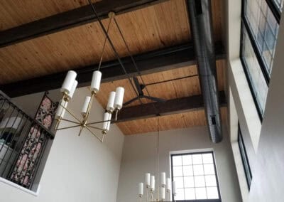 A modern chandelier illuminating a stylish living room