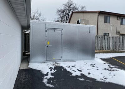 A completed electrical project for an outdoor freezer unit